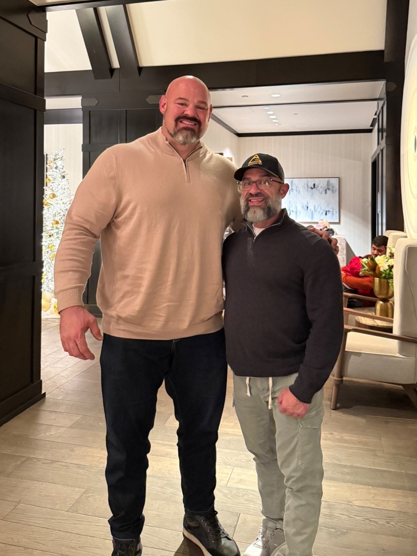 Anthony Castore standing with Brian Shaw, four-time World&rsquo;s Strongest Man champion.